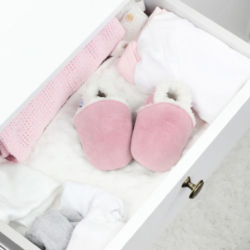 Pale pink suede slippers with fleece lining, in drawer.