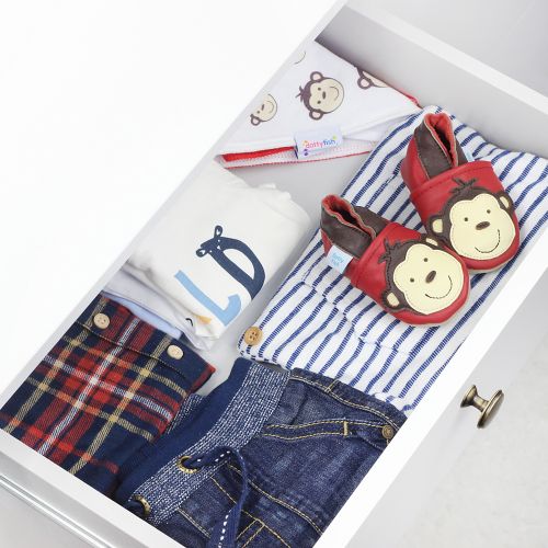 Red monkey shoes, in drawer with baby clothes.