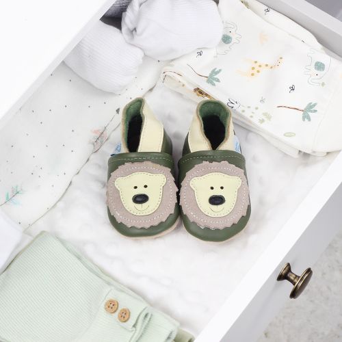 Leather bear shoes, in drawer with baby blankets.