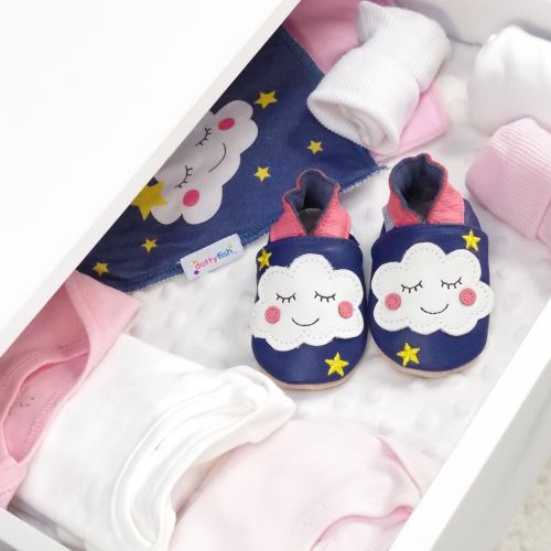 Navy leather cloud shoes, in drawer with baby clothing.