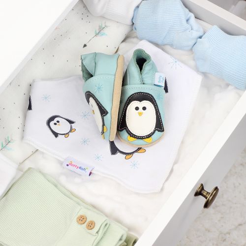 Leather penguin shoes, in drawer with baby clothing.