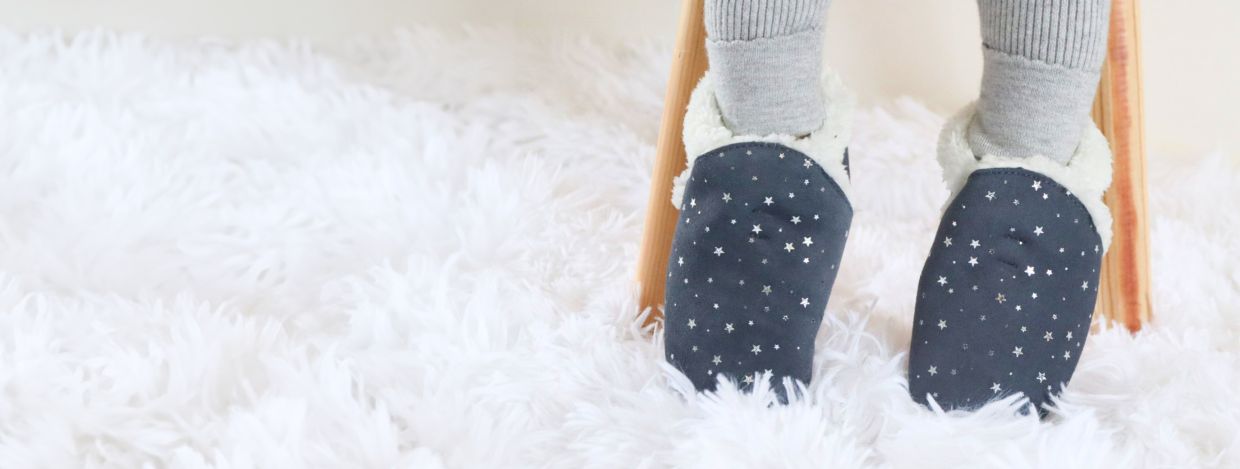 Girls wearing Dotty Fish Silver Star suede slippers