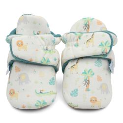 Cream cotton baby booties with green fleece lining and safari pattern.