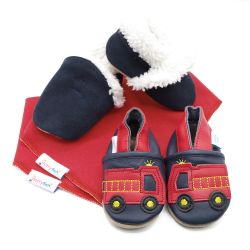 Dotty Fish baby gift set including navy suede slippers, leather fire engine shoes and two red cotton bibs.