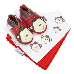 Dotty Fish baby gift set including leather monkey shoes, a white with monkey pattern and a red cotton bib.