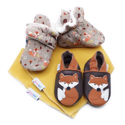 Dotty Fish baby gift set including cotton woodland booties, leather fox shoes and two mustard yellow cotton bibs.